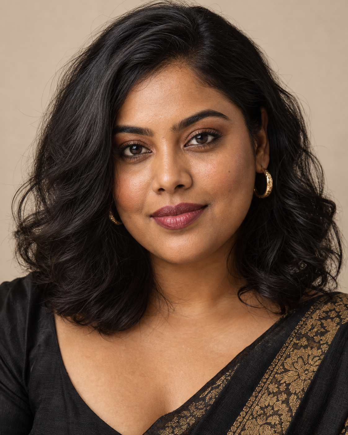 Priya Sharma, a makeup artist in an editorial studio portrait.